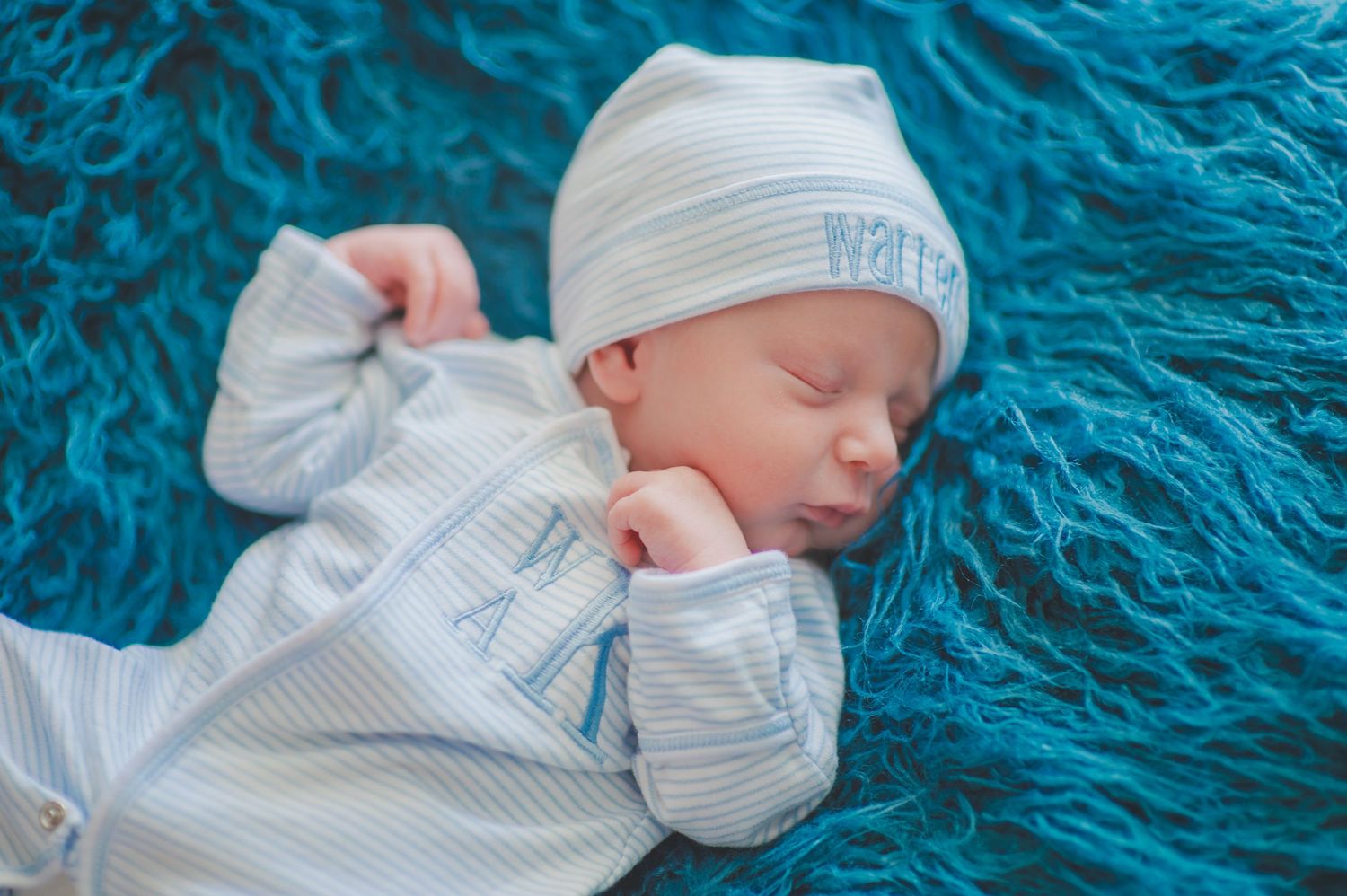 newborn boy pose natural light photography studio session wrap custom creative set memory captured Alabama Baldwin county sleeping