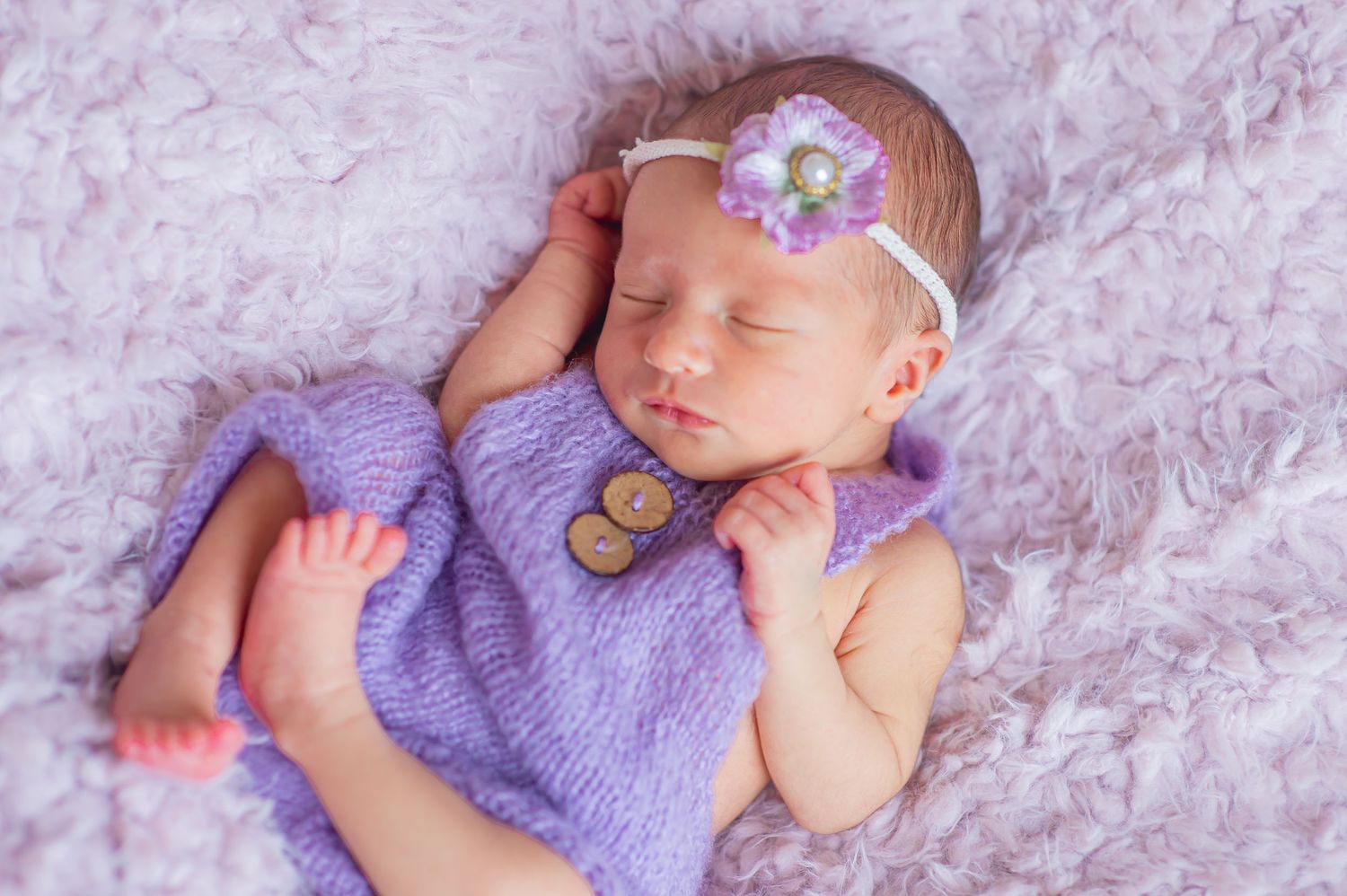 Newborn baby girl swaddle wrapped headband soft focus sweet baby little bundle of smile captured sleepy baby Alabama Fairhope