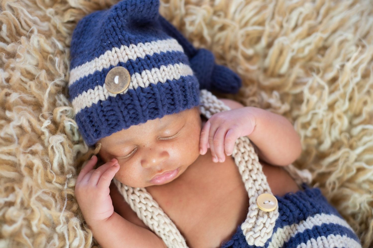 newborn boy pose natural light photography studio session wrap custom creative set memory captured Alabama Baldwin county sleeping
