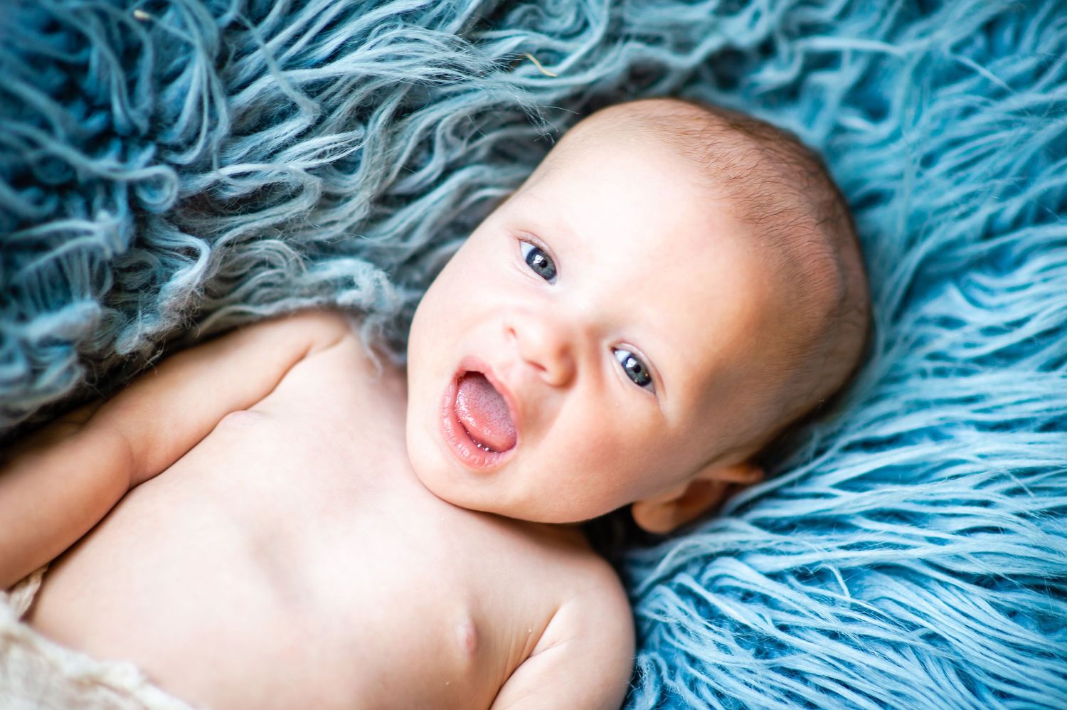 baby boy creative set natural light pose custom set studio session milesone photography Baldwin county Alabama Opp laugh
