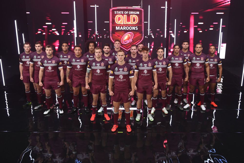 Queensland State of Origin team with studio lights and glossy floor