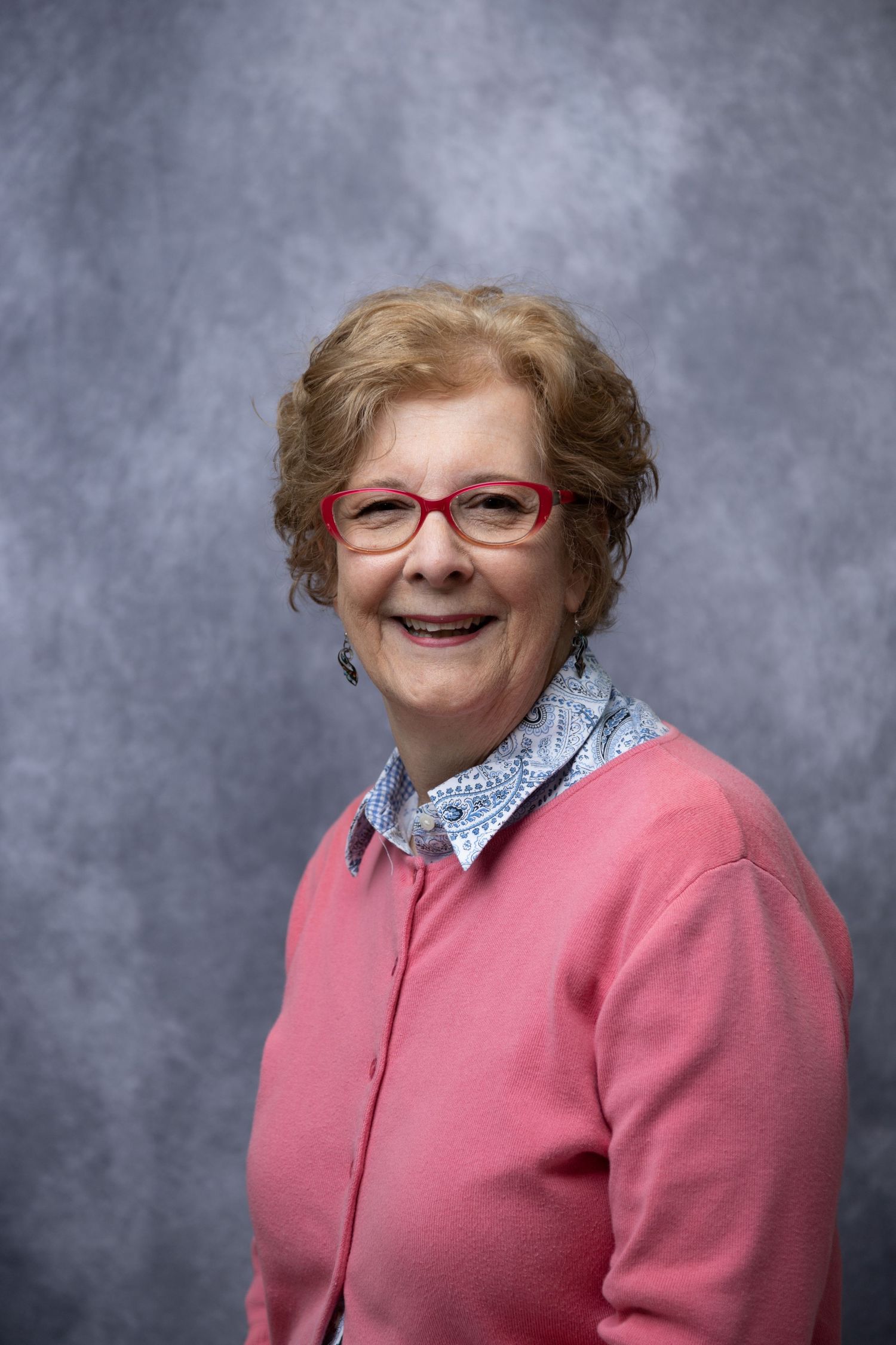Business owner smiling during headshot session