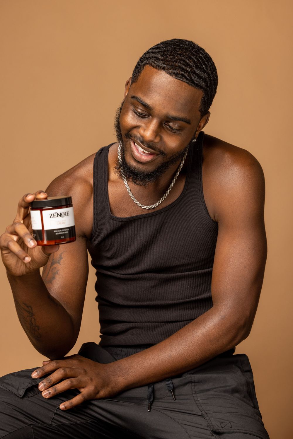 Product lifestyle photography featuring skincare items against warm brown background.