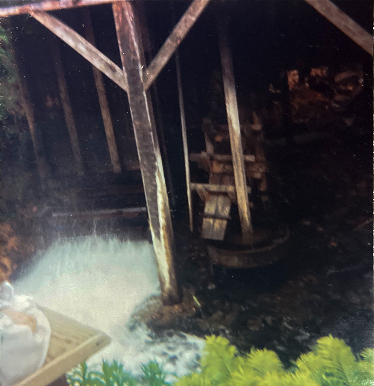 Retro square photograph of wood beams and water taken on film