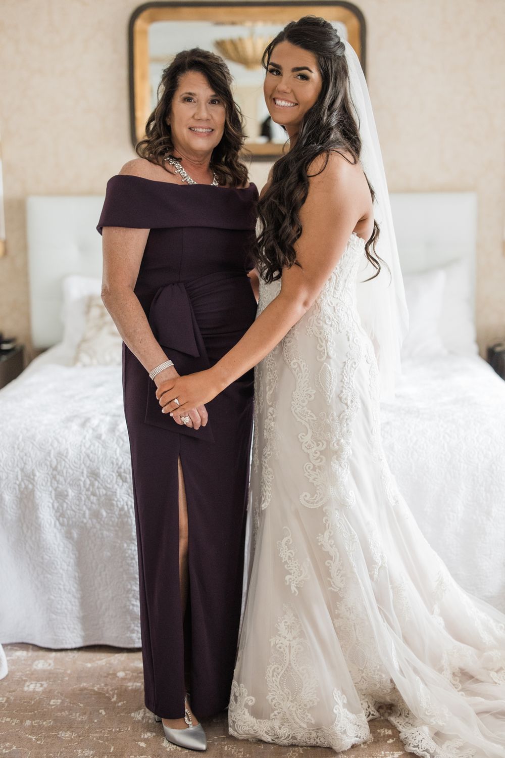 Beautiful wedding day portrait in elegant white lace gown.
