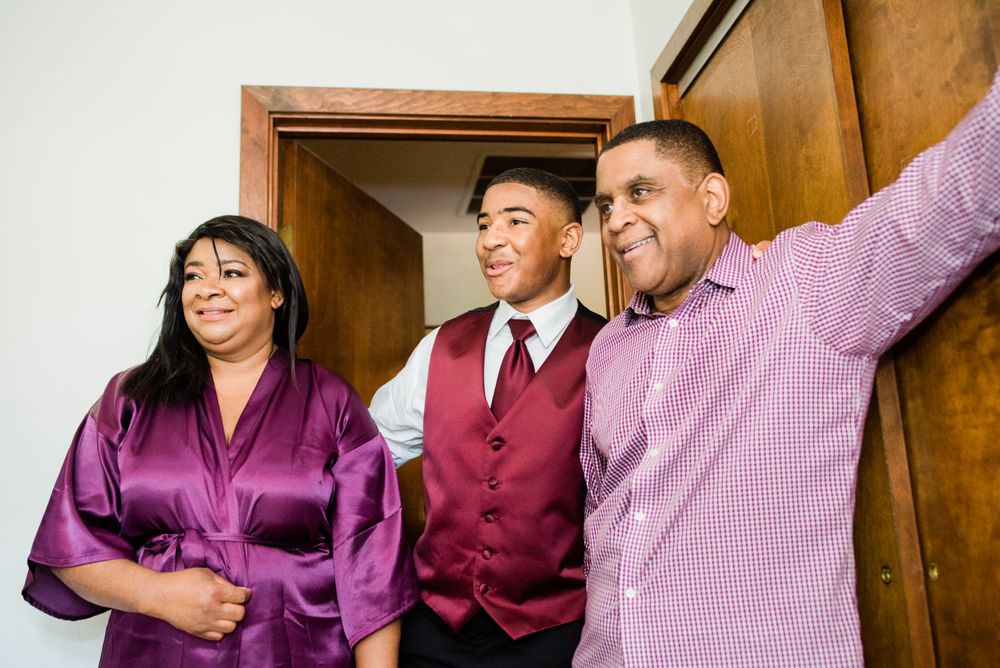 family looking at groom