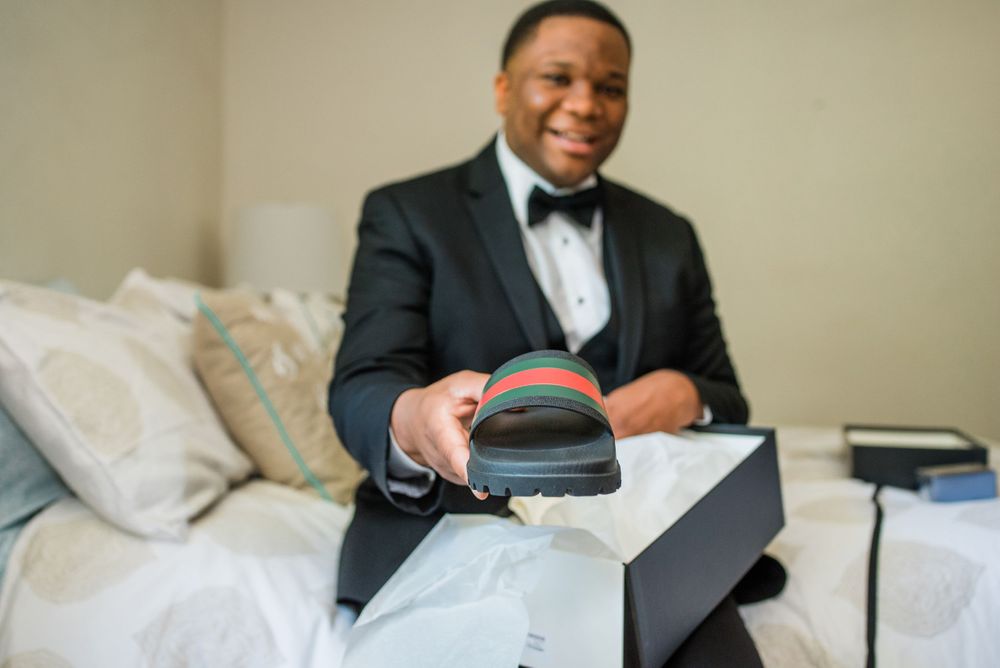 groom showing his Gucci slides