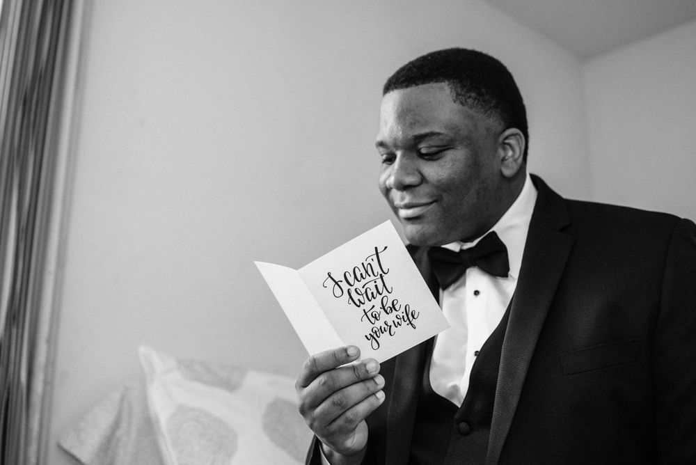 groom reading card