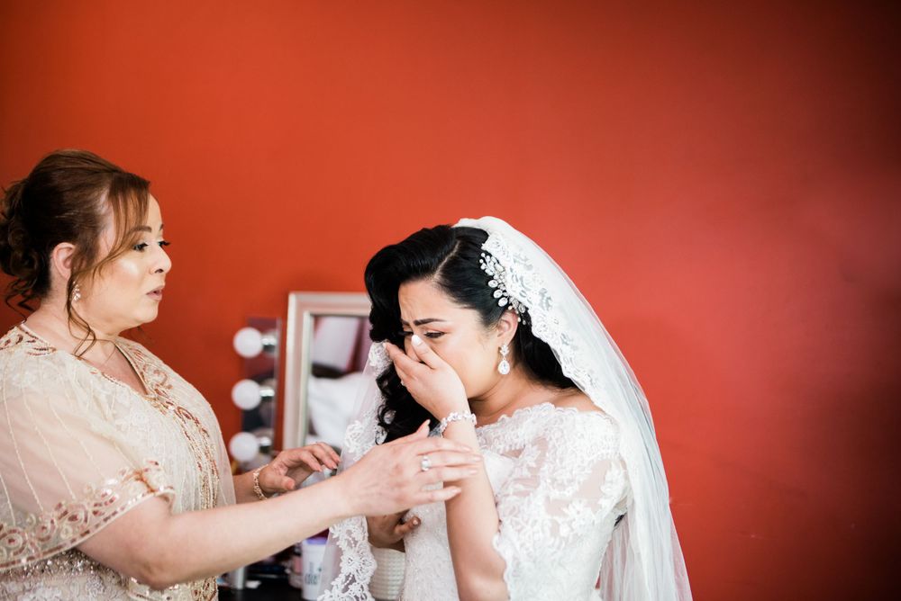 bride crying with mother of the bride