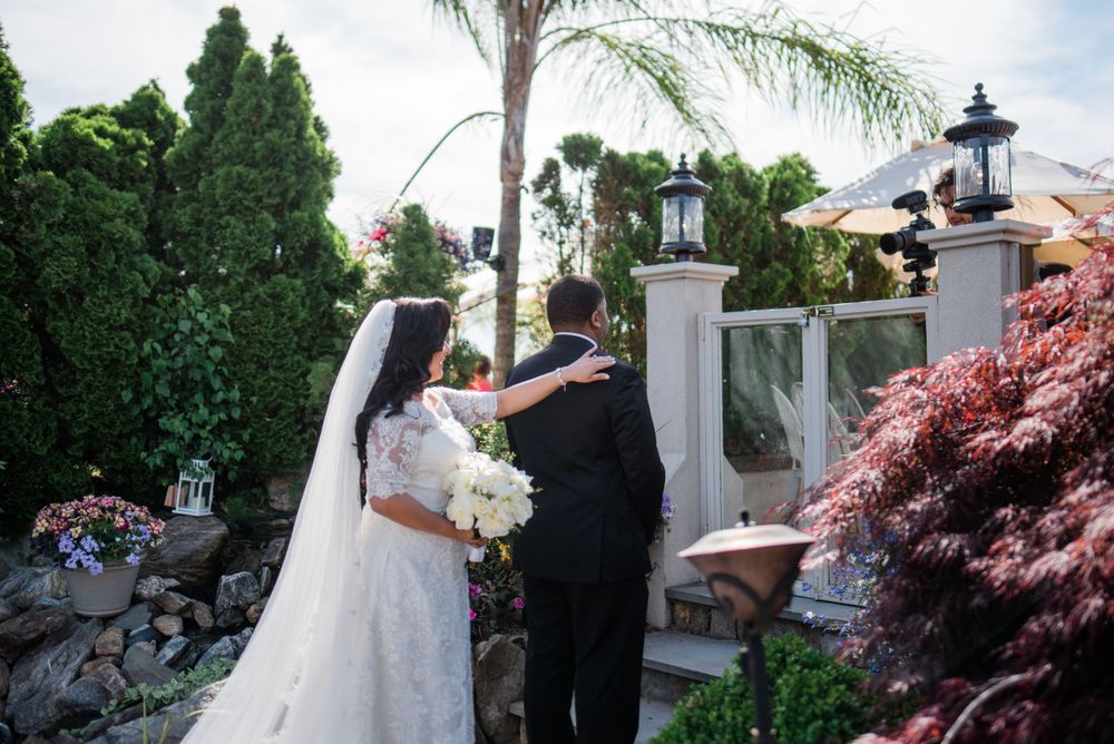 bride touches groom on shoulder
