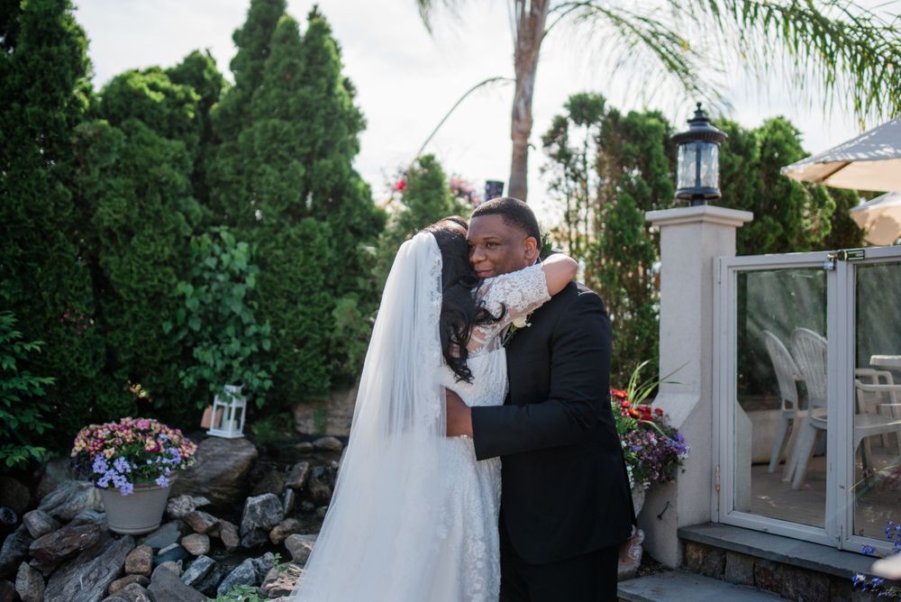 bride and groom hug