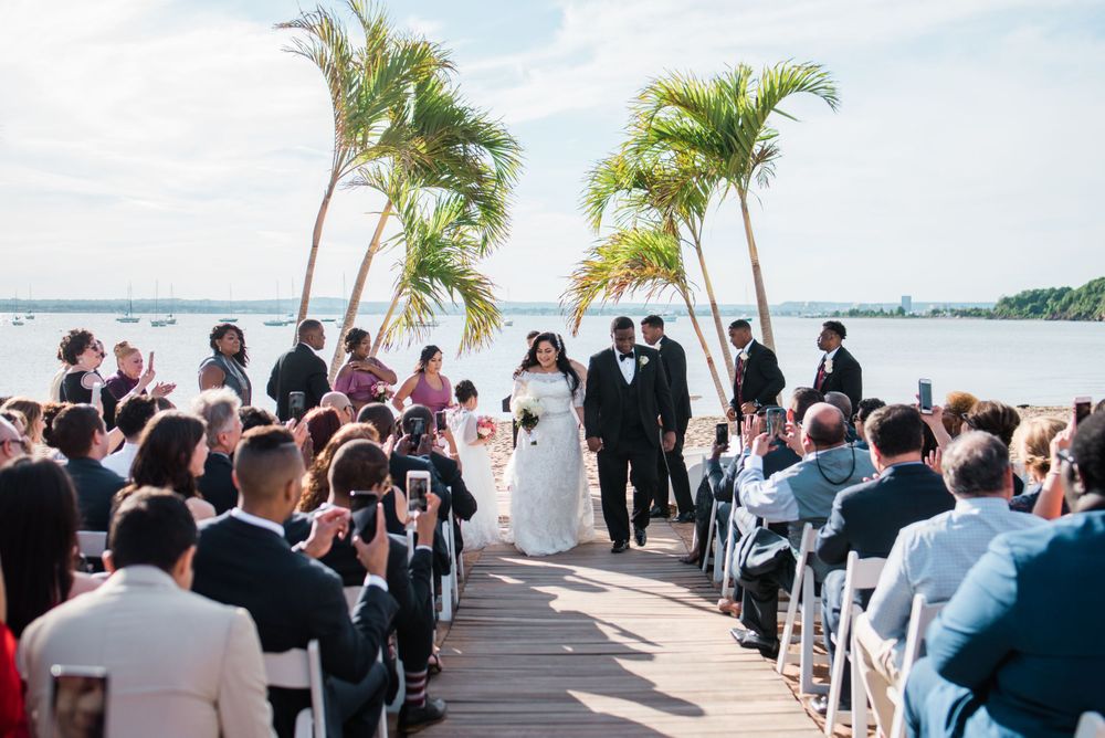 groom and bride walking up the aisle