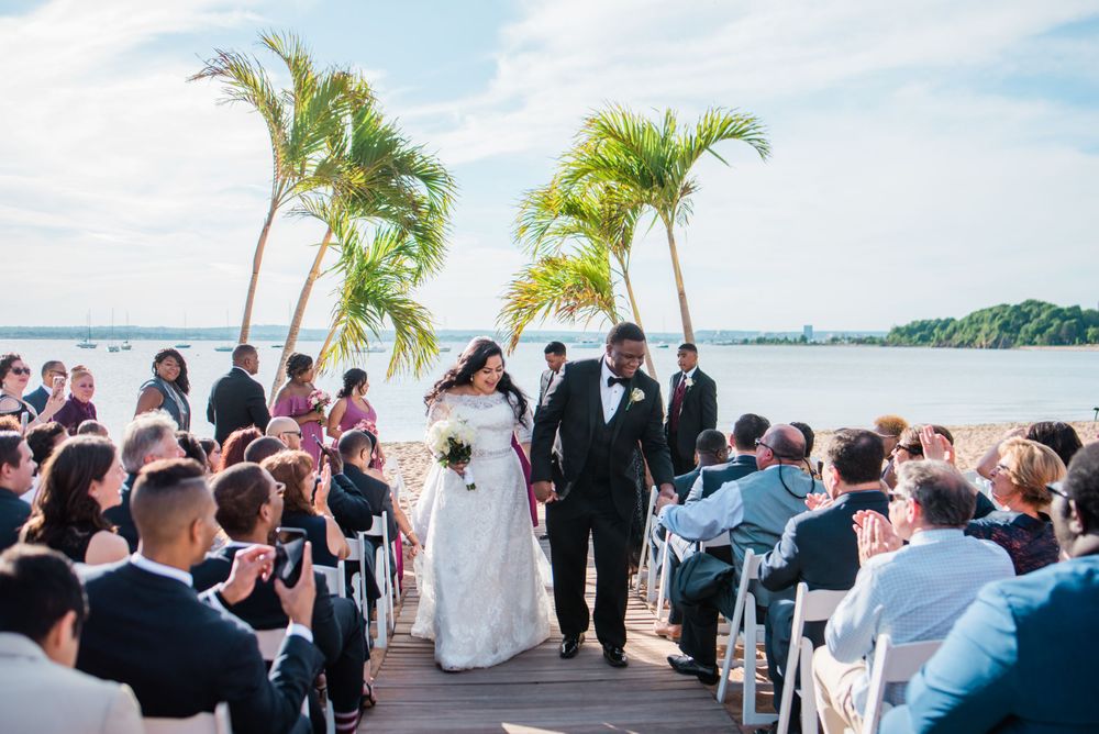 groom and bride walking up the aisle