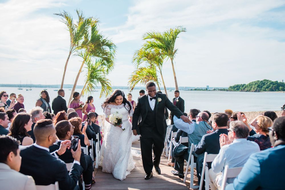 groom and bride walking up the aisle