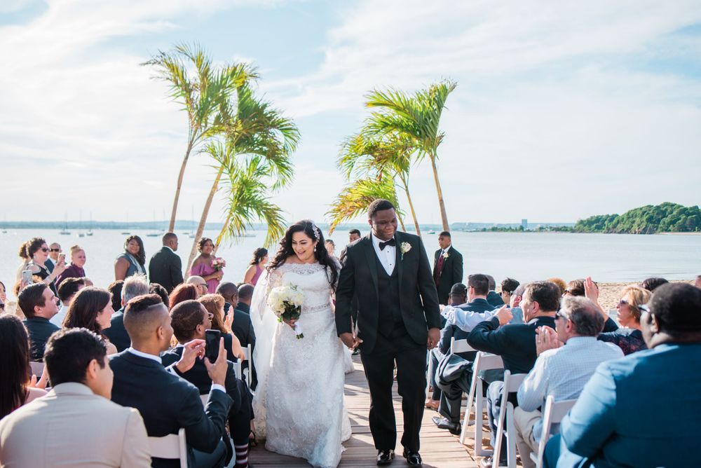 groom and bride walking up the aisle