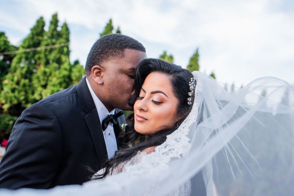 bride's veil and groom portrait