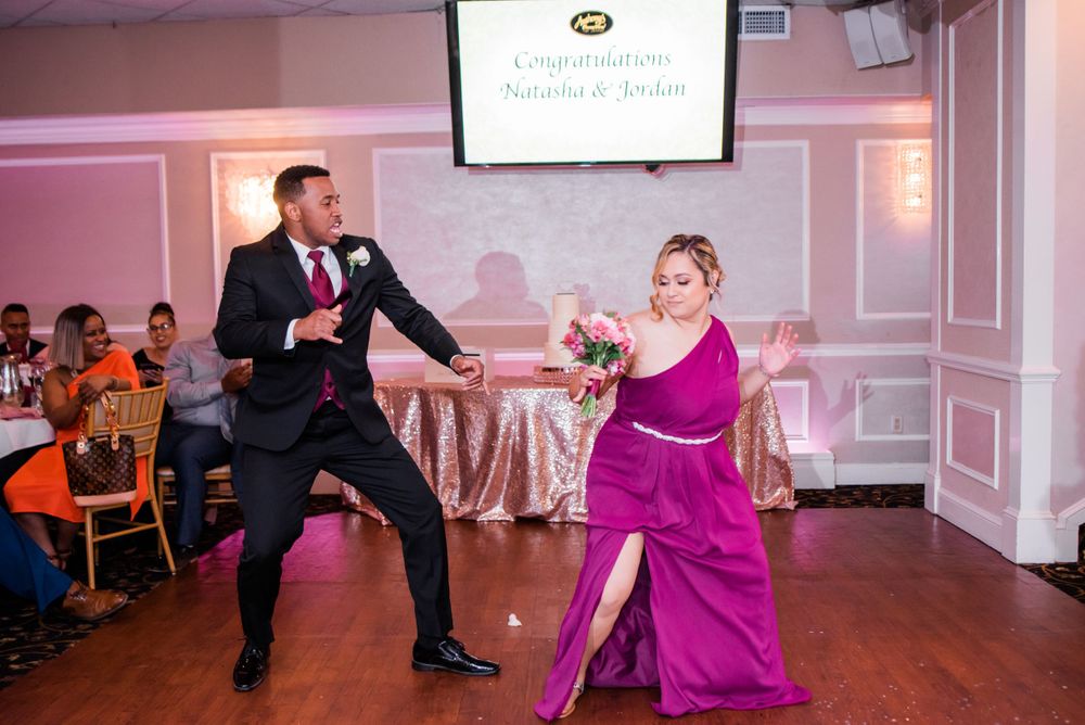 groomsmen and bridesmaid dancing in reception
