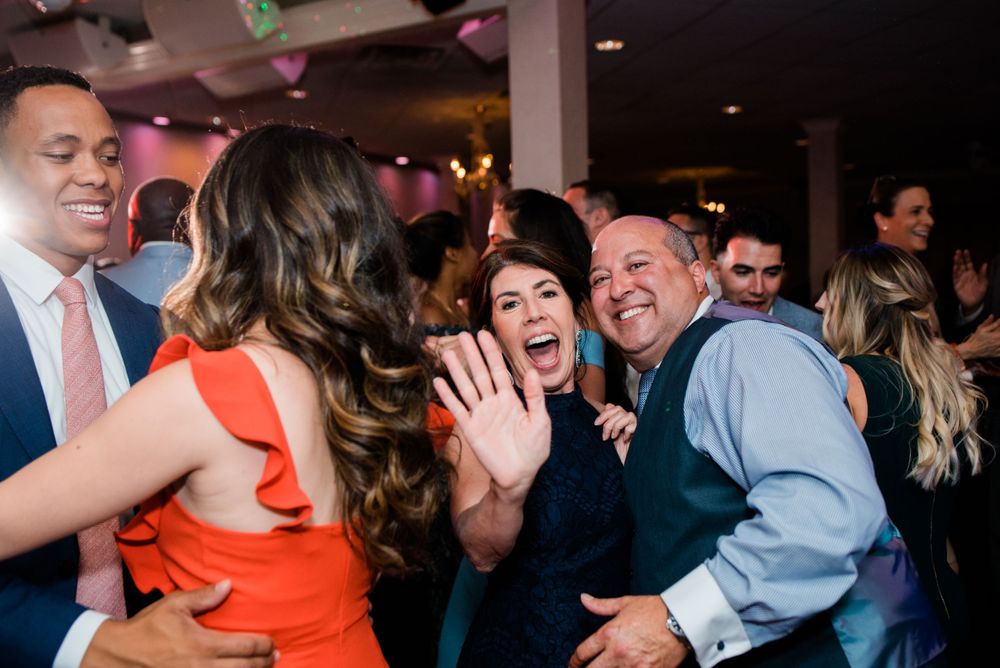 wedding guest dancing at reception