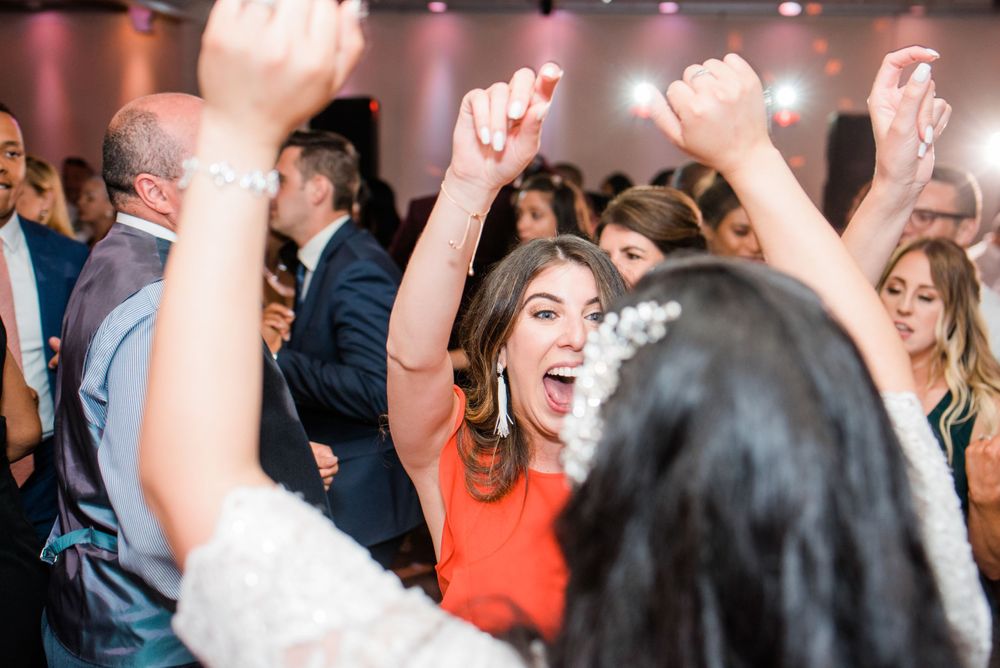 bride and wedding guest dancing at reception