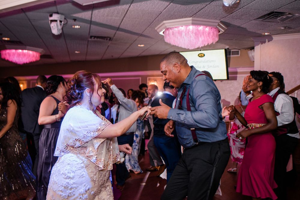 bride and wedding guest dancing at reception