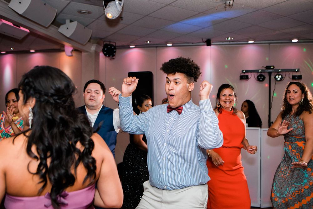 wedding guest dancing at reception