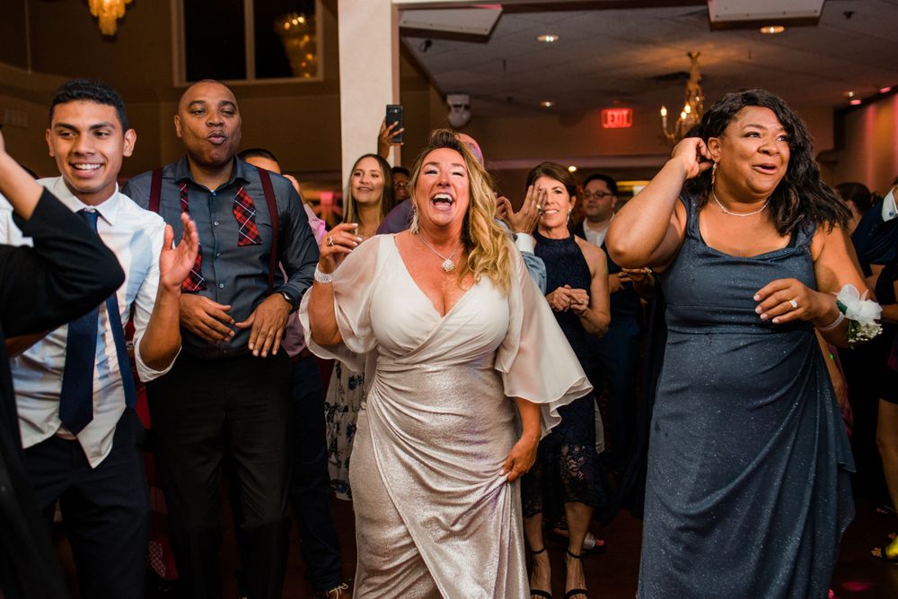 wedding guest dancing at reception