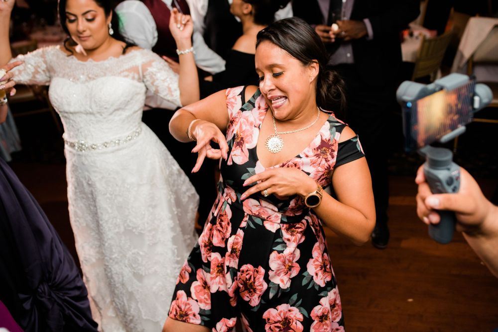 wedding guest dancing at reception