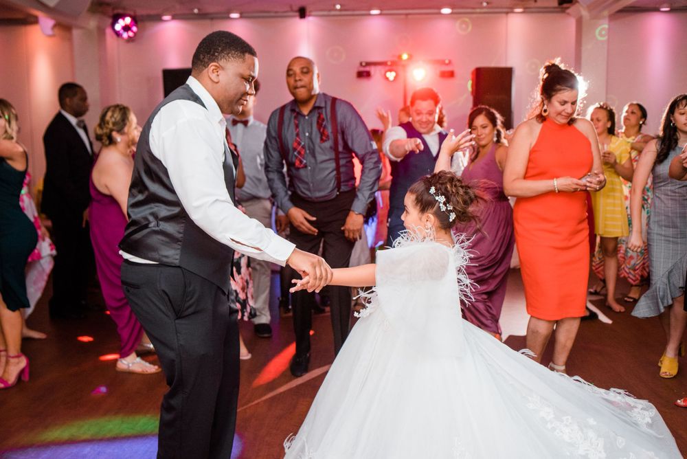 groom dancing with junior bride