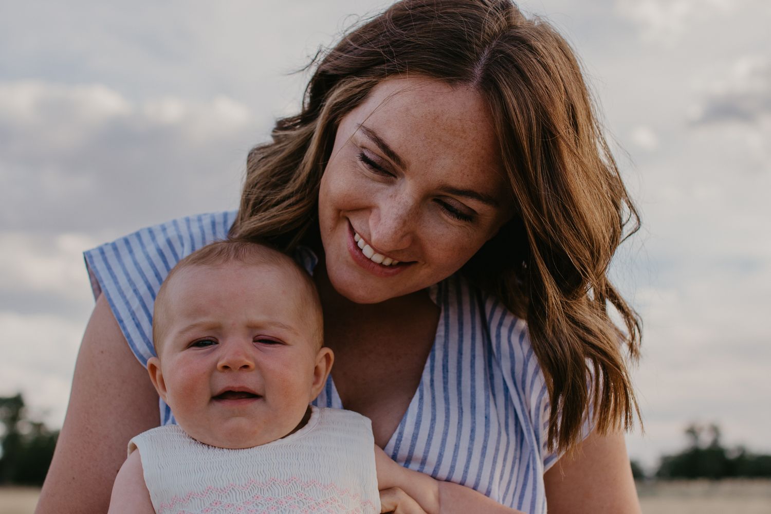 Mother and daughter in a rural landscape