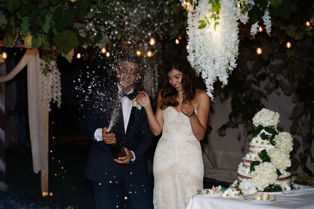 bride and groom champagne pop