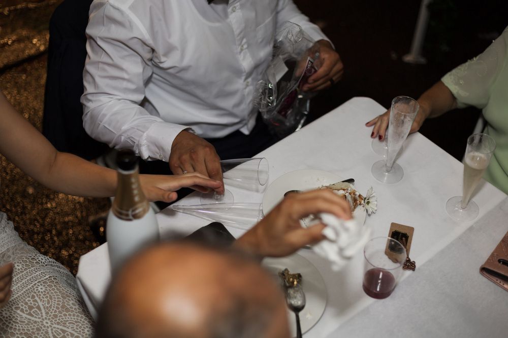 bride and groom details of them drinking