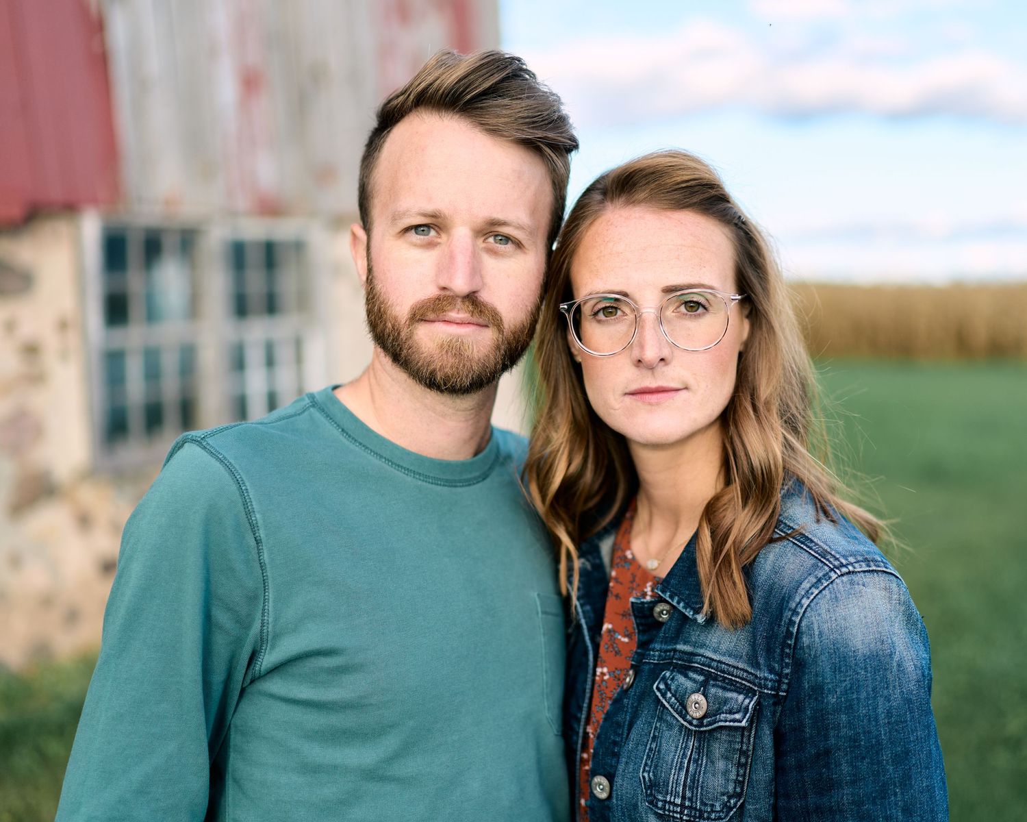 An outdoor portrait of Chris and Kelly Manzeck, owners and principal photographers at Manzeck Photography