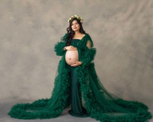 Artistic maternity portrait in emerald green flowing gown with delicate floral crown.