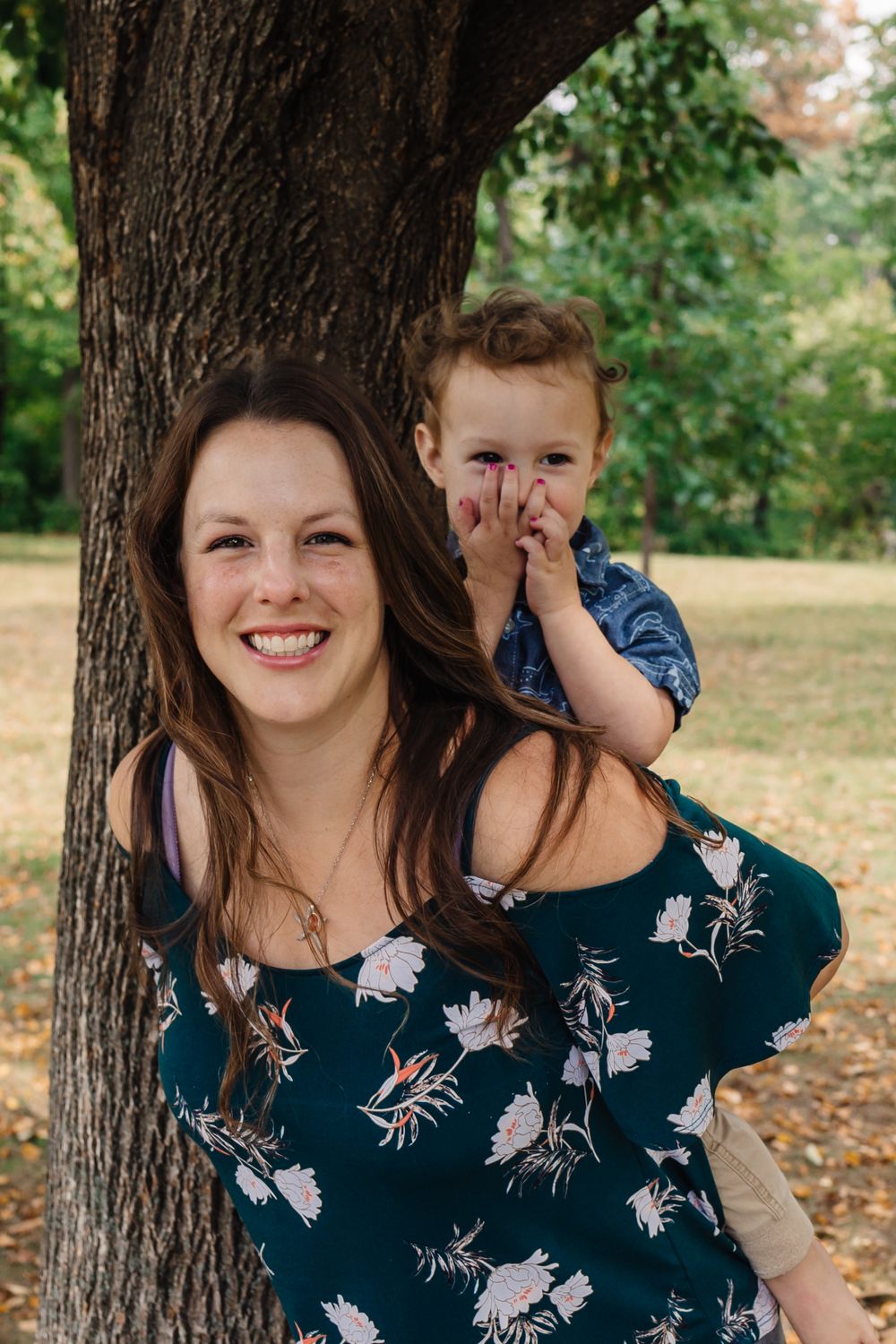 Candid autumn portrait sequence showing joyful expressions under a large tree.