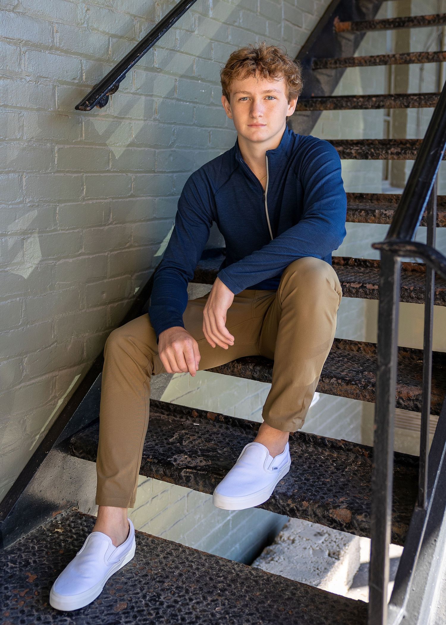 high school senior photography, beverly hills, mi. boy sitting on steps