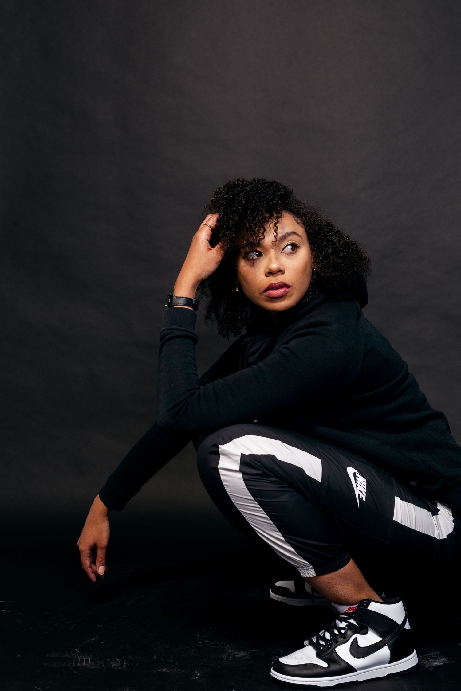 Dynamic black and white photo sequence featuring a person in athletic wear making expressive movements.