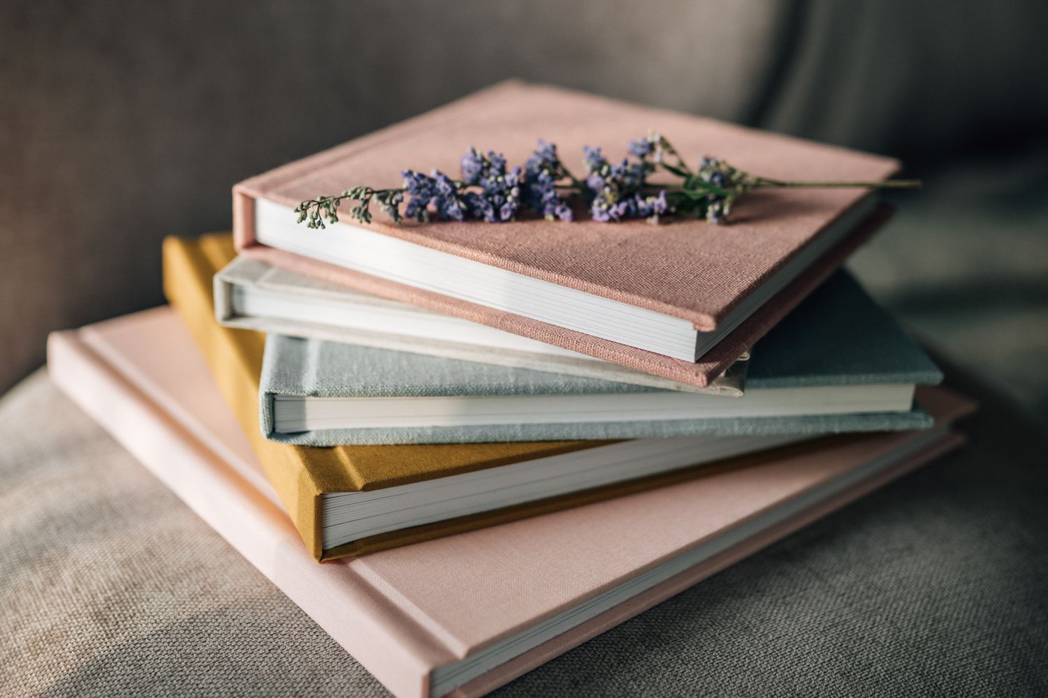 selection of photo albums in pastel colors with purple flowers