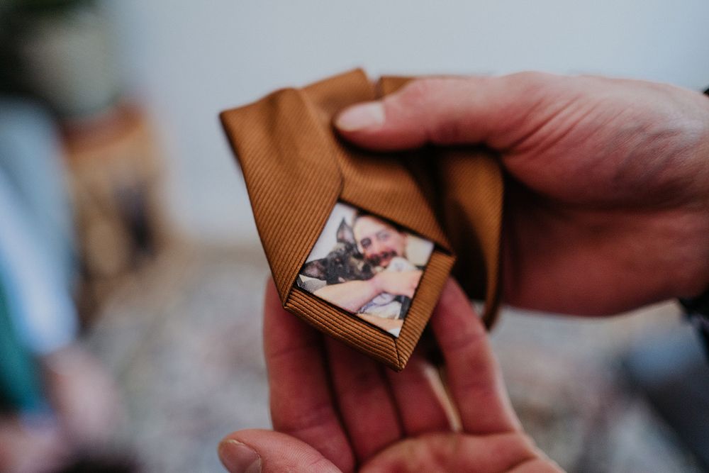grooms tie with an image of him and his dog on it