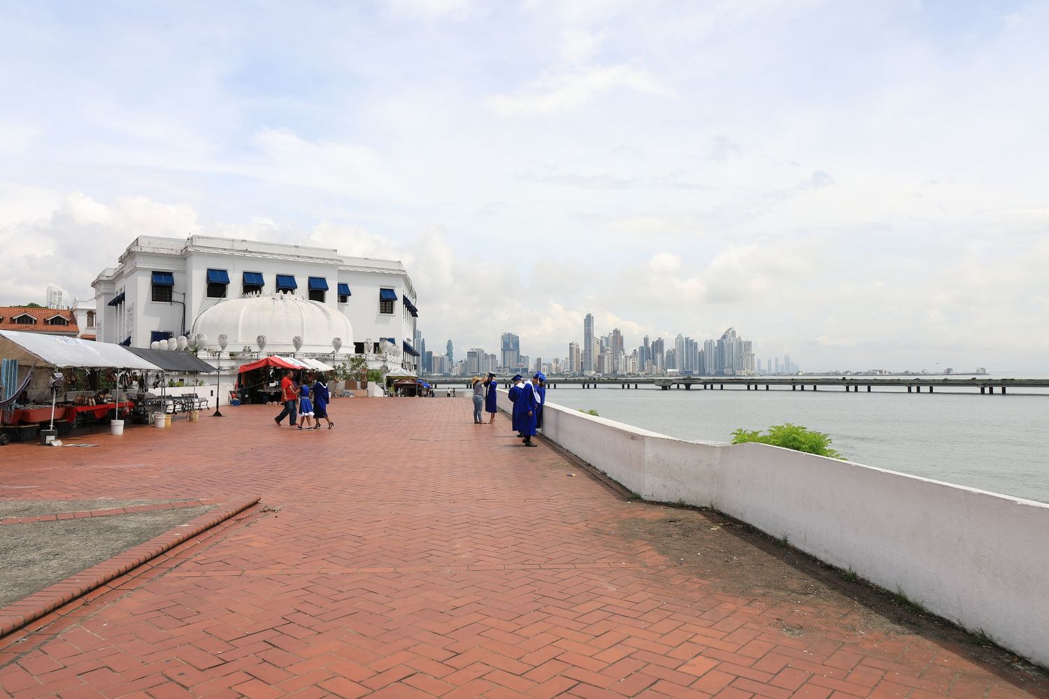 Scenic waterfront promenade in Panama City with modern skyline visible in the background.