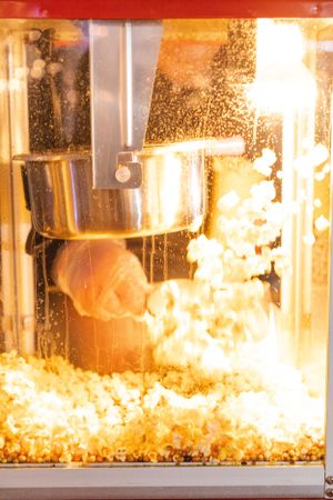 Dramatic flames and sparks erupting inside a glass enclosure during a controlled demonstration.
