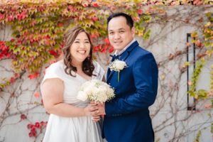 Groom and Bride looking at the camera and smiling after the wedding