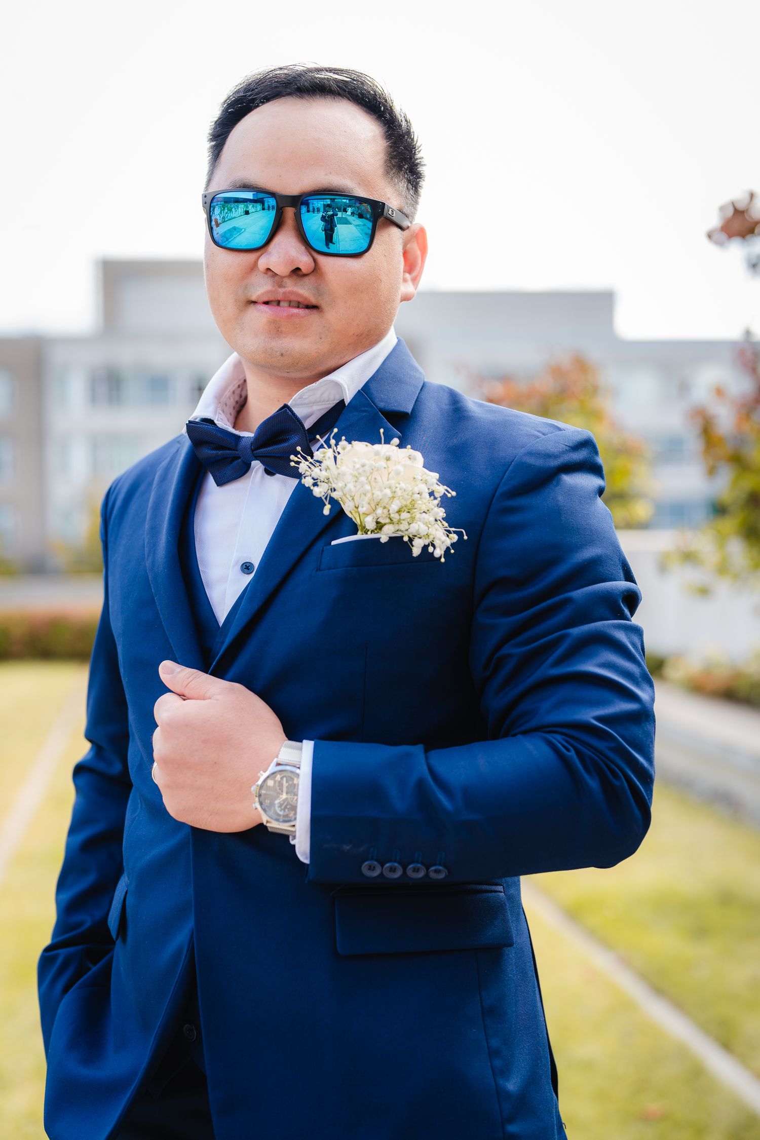 Handsome Groom looking straight at the camera pose