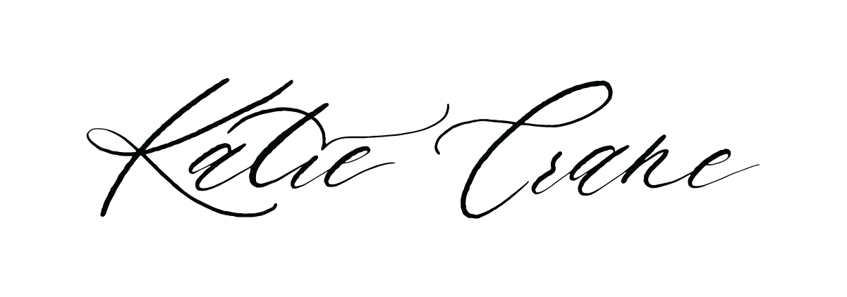 Elegant handwritten signature in black ink on white background.