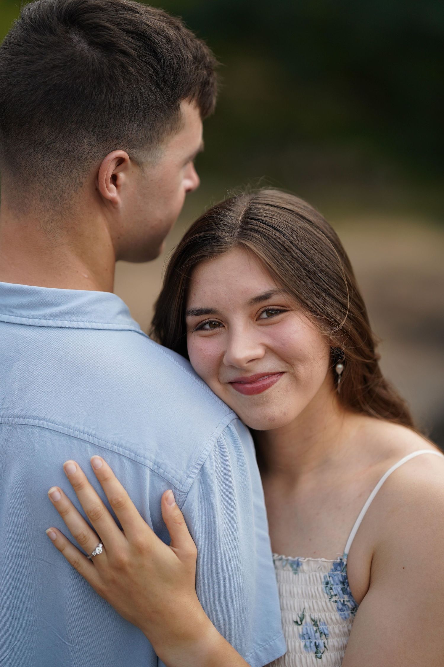 Romantic engagement photos showing couple in intimate poses.