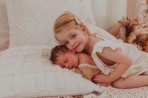 A series of serene bedtime photos showing a child resting peacefully on white bedding with soft lighting.