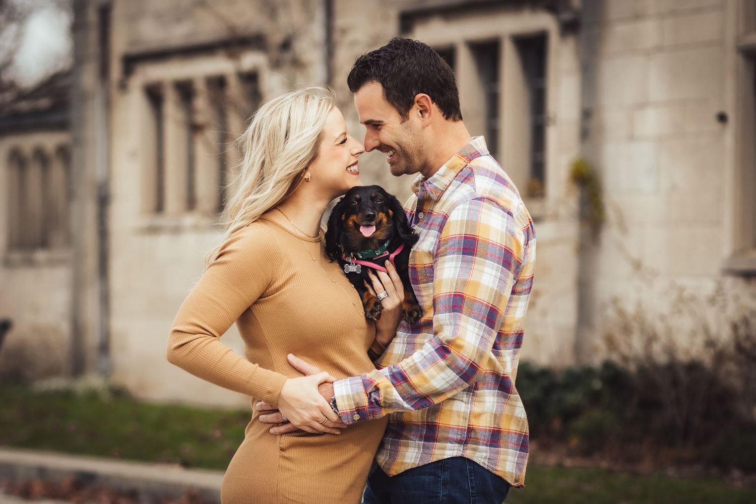 flawless moment between an expecting wife and her excited husband. Candid photo at it's finest