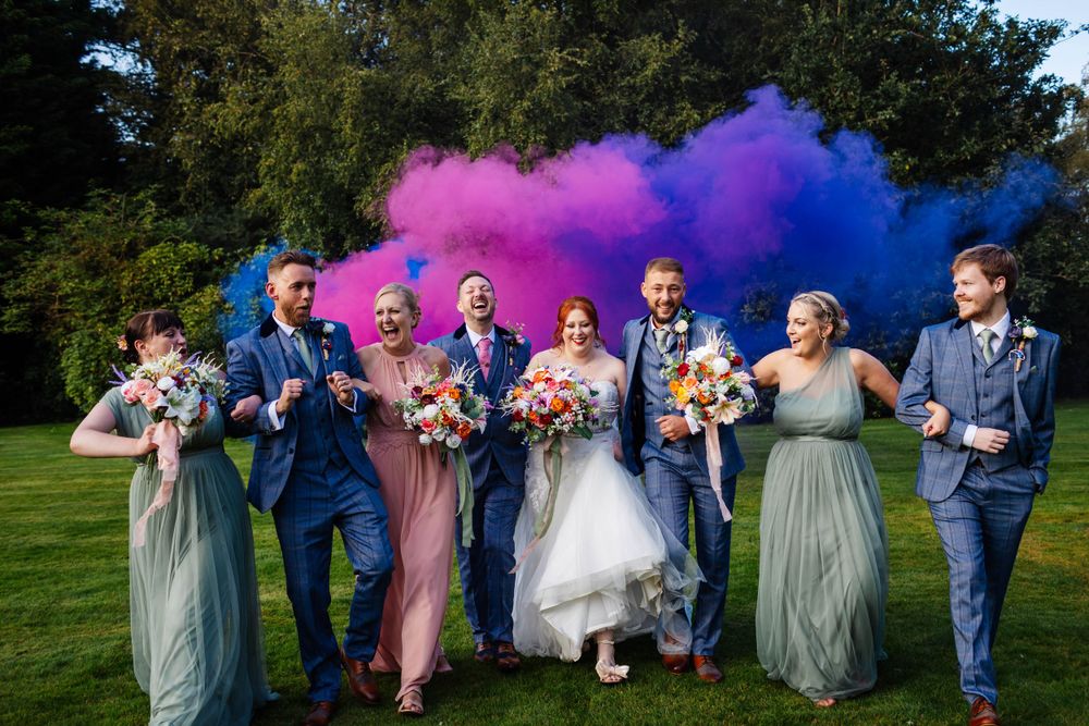Bartle Hall Wedding Photography, group photo with bridal party, fun and colour image with smoke bombs