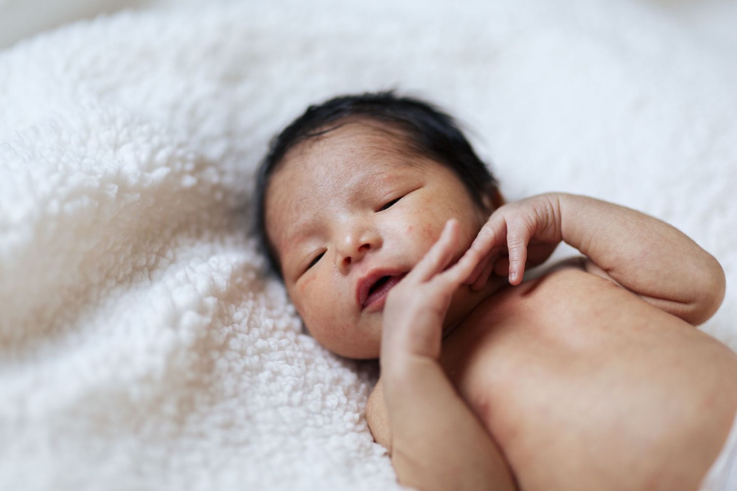 Everett Newborn photographer: a newborn baby boy at home in a lifestyle newborn family session