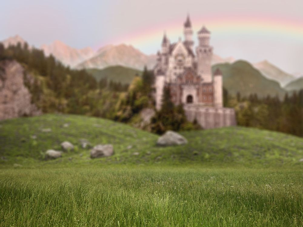 Digital backdrop of a castle and a rainbow.