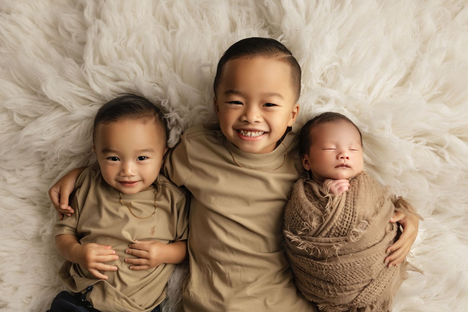 sibling with newborn baby
